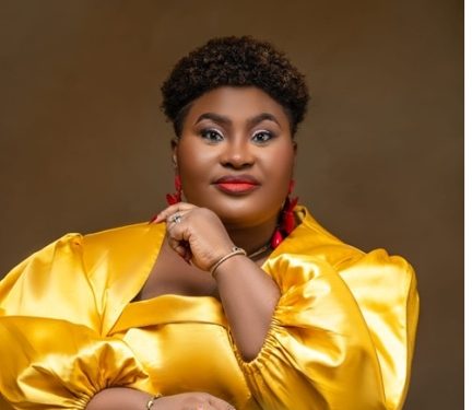 Nigerian gospel minister Judikay in a yellow satin outfit