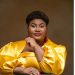 Nigerian gospel minister Judikay in a yellow satin outfit