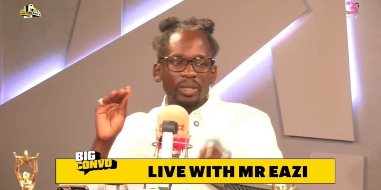 Mr Eazi speaking into a microphone during his Big Convo interview on 3Music TV