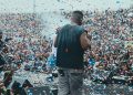Sarkodie on stage facing a packed Baba Yara Sports Stadium crowd under falling confetti at Rapperholic Kumasi '26