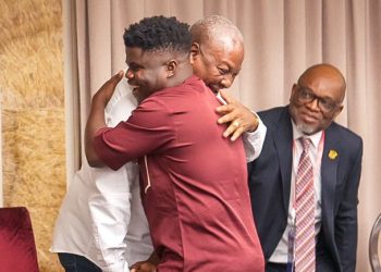 President John Dramani Mahama hugs YouTuber Wode Maya at a meeting with Ghanaians in Russia in Moscow